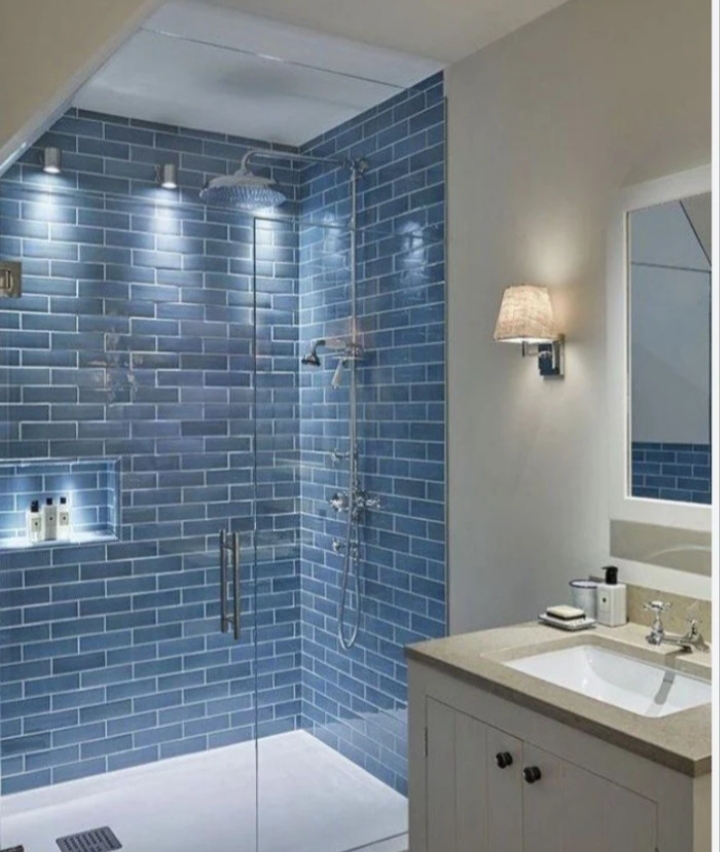 Blue tile shower installation and plumbing work